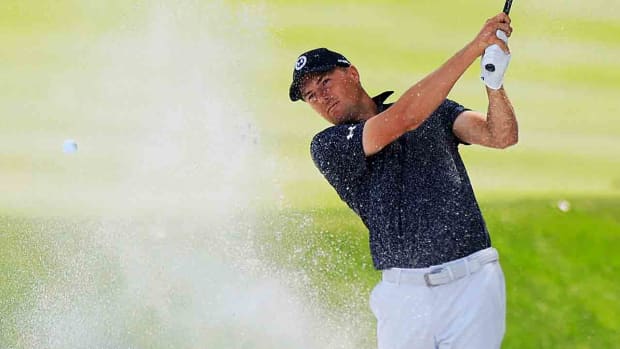 Jordan Spieth plays a shot from a bunker during the 2024 Players Championship at TPC Sawgrass in Ponte Vedra Beach, Fla.